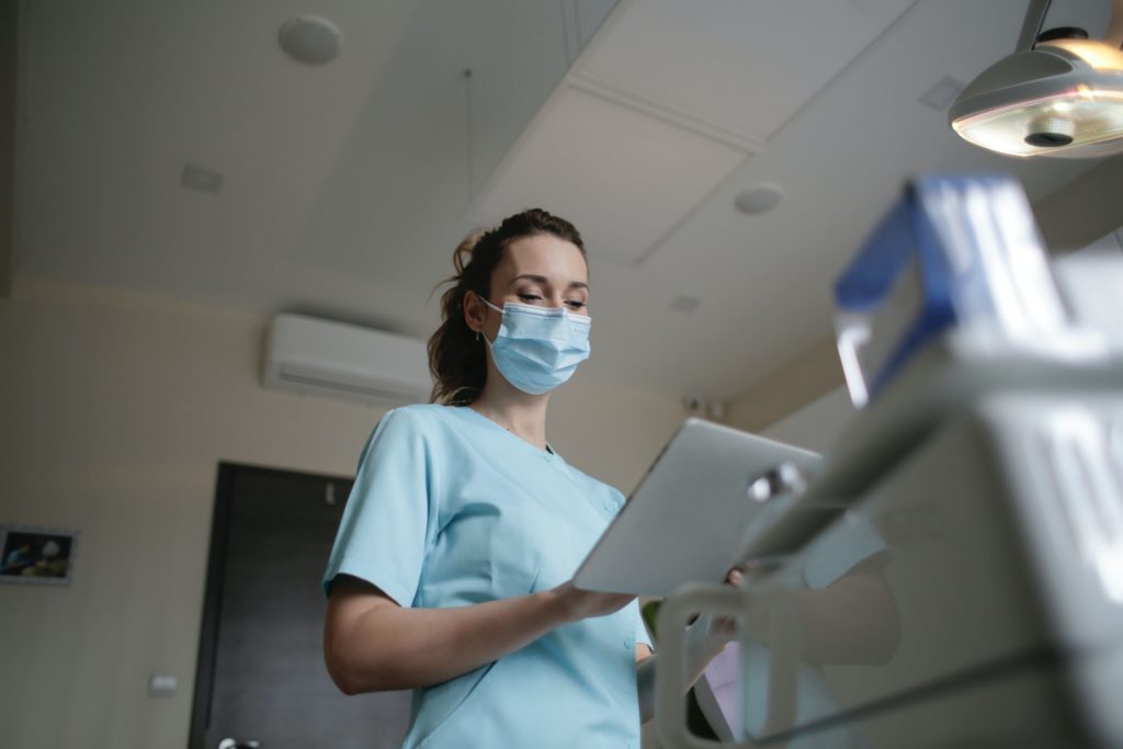 nurse working on a device