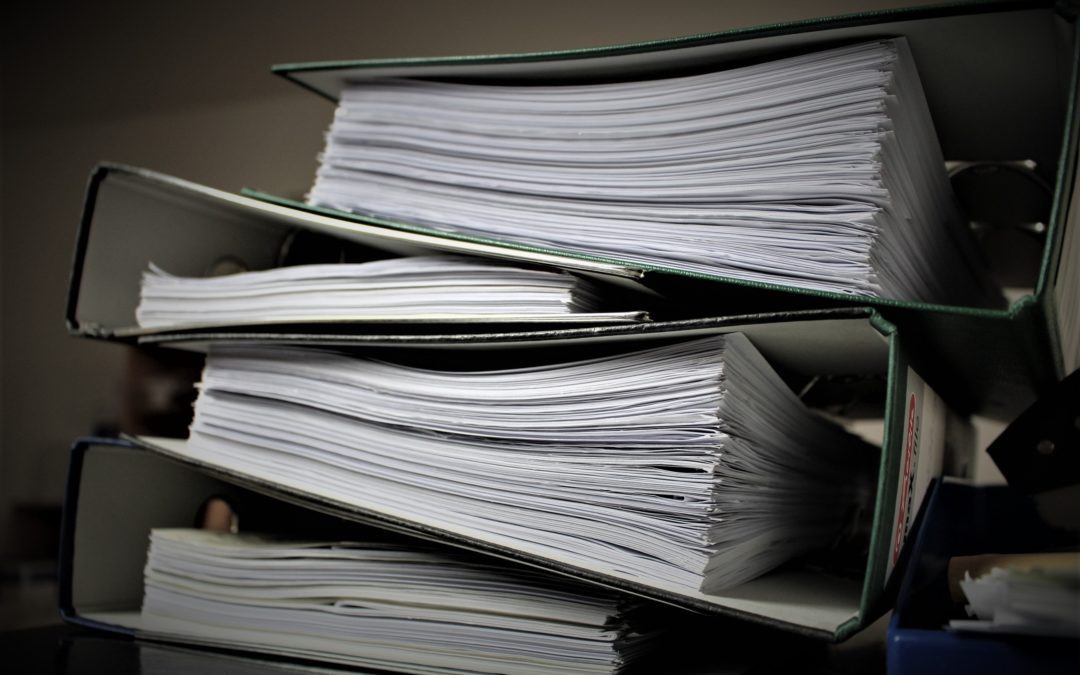 Four folders stacked on top of each other containing policies