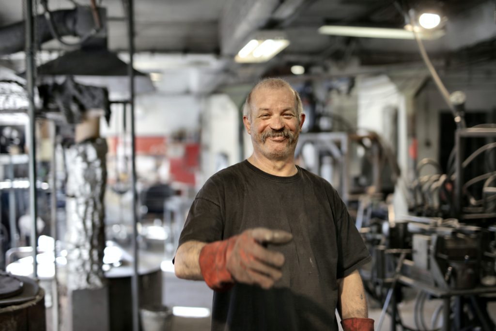 Happy worker in his workplace