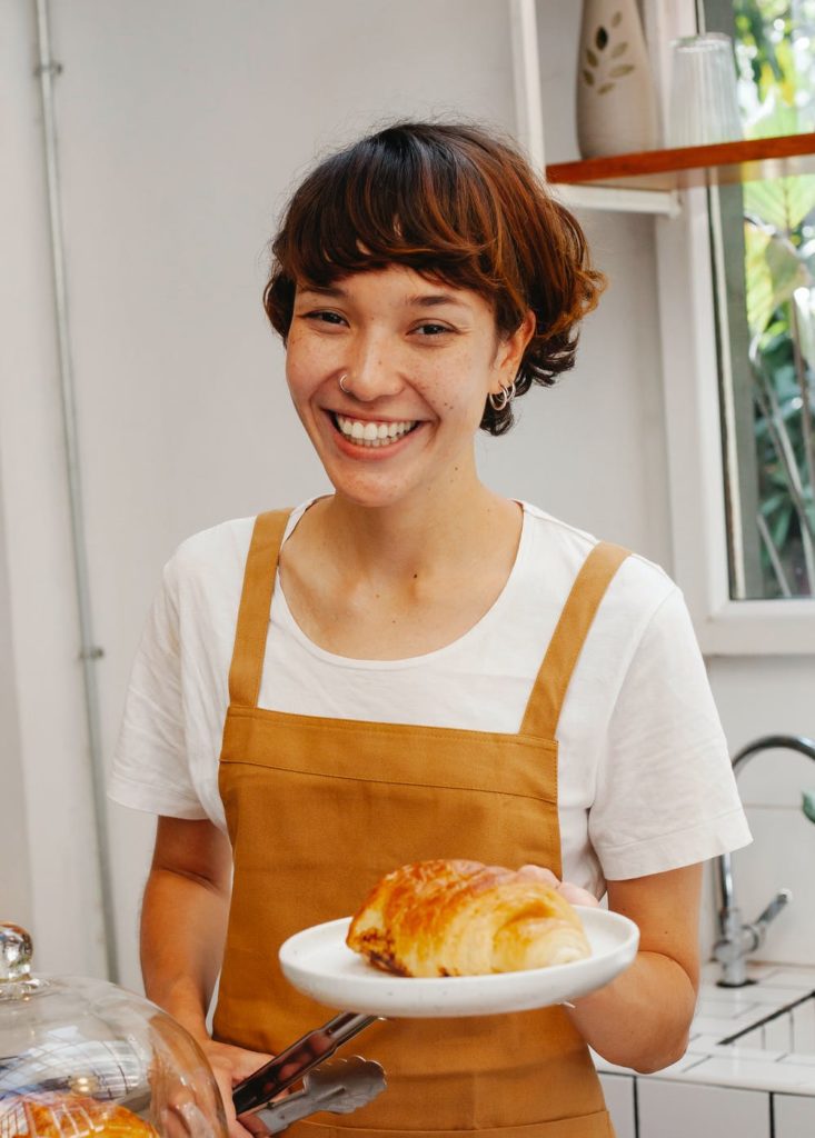 True depiction of a satisfied employee serving baked good