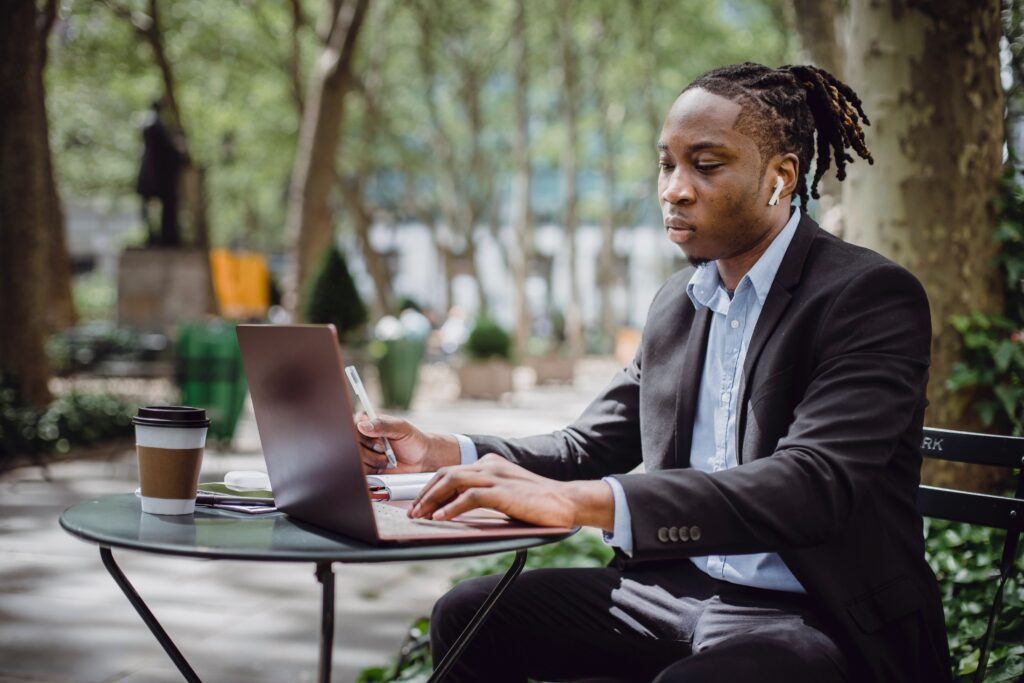 Person drinking a coffee while working.