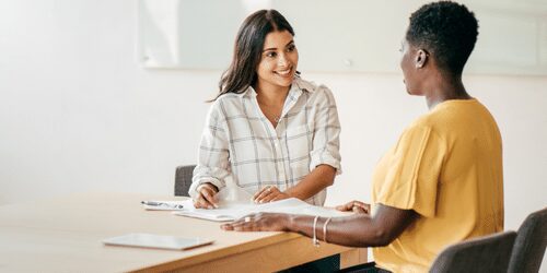 two employees connecting with one another.
